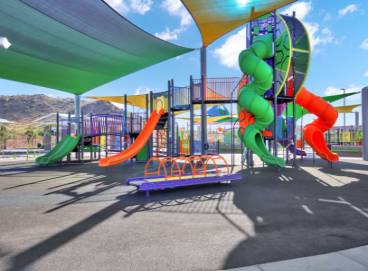 Large outdoor playground set featuring a double tower slide
